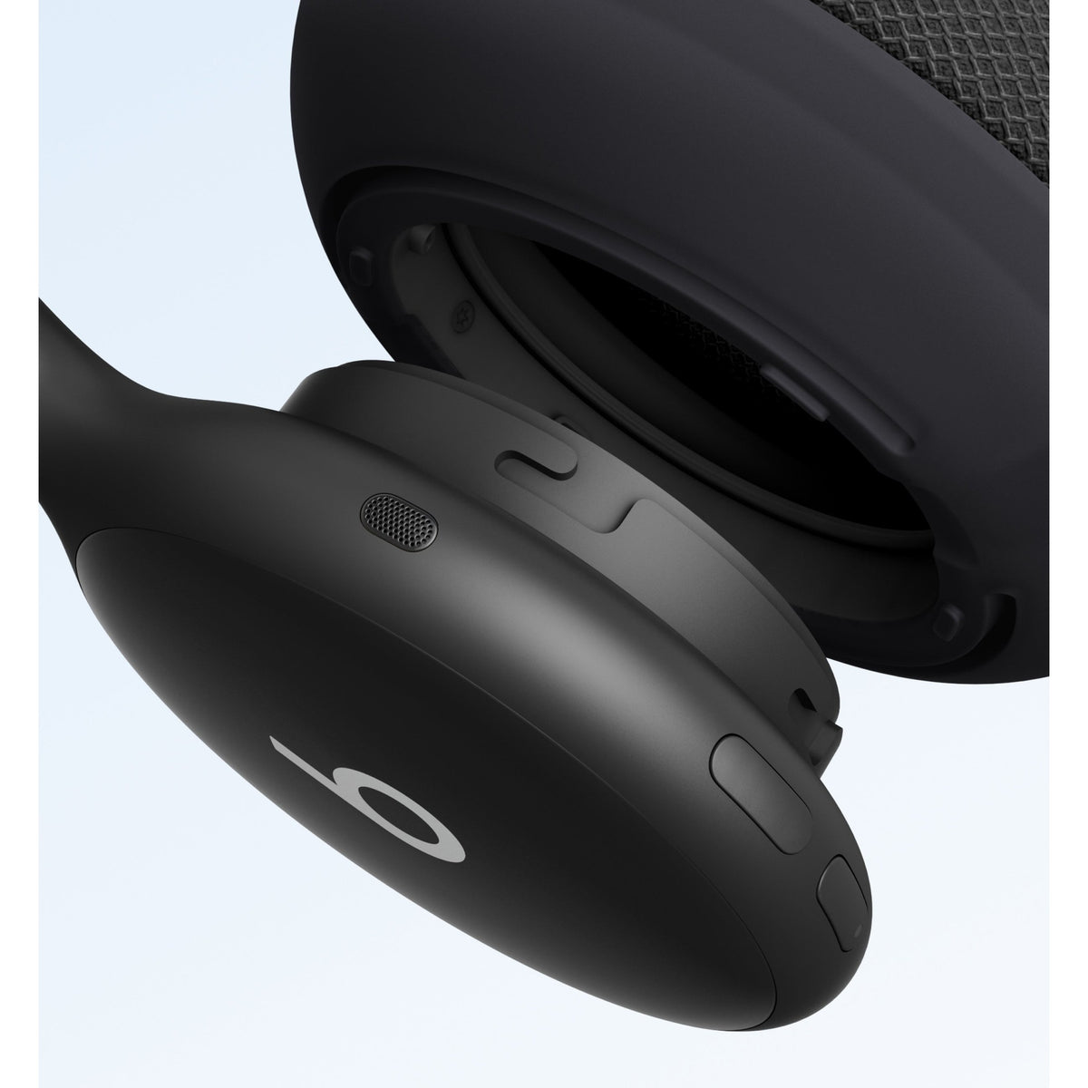 Close-up of black Beats 360 headphone controls and speaker grille